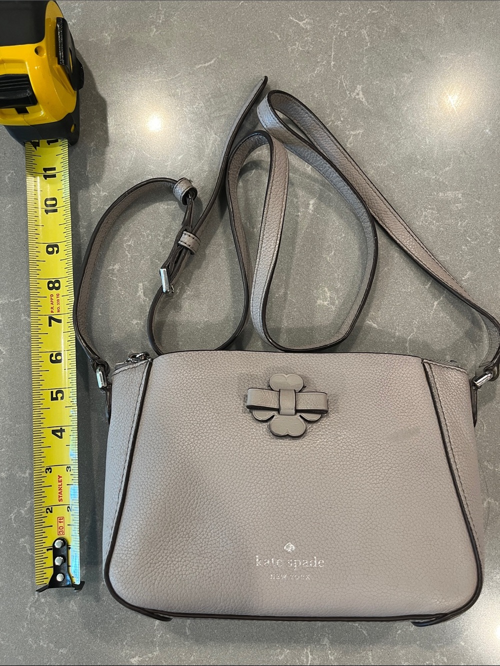 kate spade gray taupe pebbled leather crossbody with bow charm